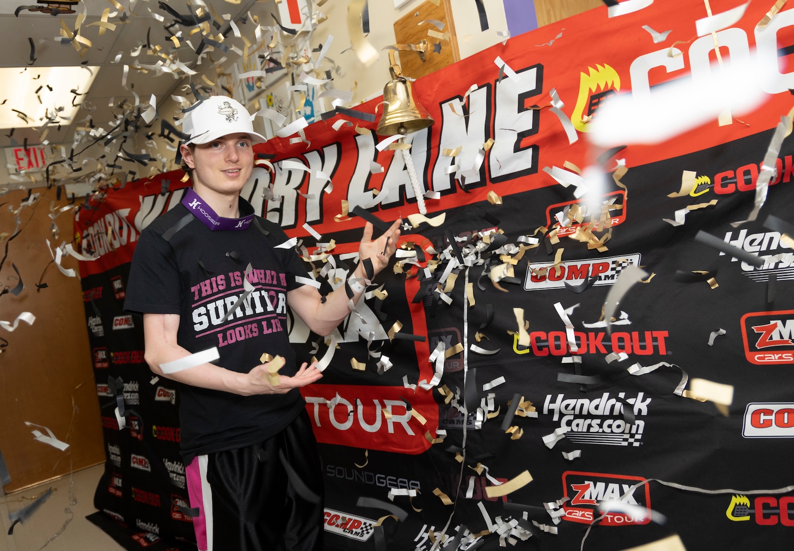 Celebrating a milestone in his cancer treatment, Landon McKearn, 15, stands among confetti after ringing the bell in Walter Reed’s Pediatrics Hematology/Oncology Clinic on June 14.