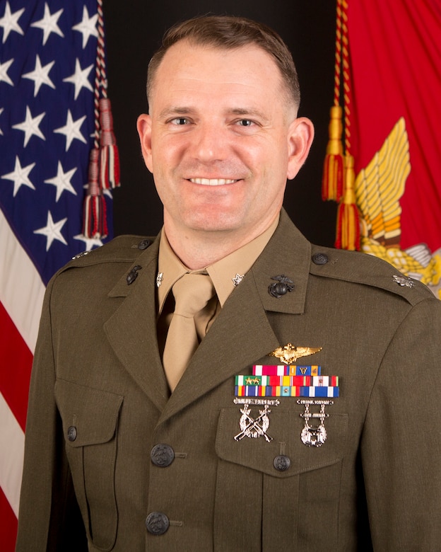 U.S. Marine Corps Lt. Col. James K. Everett, the commanding officer of Headquarters and Headquarters Squadron, Marine Corps Air Station Miramar, poses for his command photo on MCAS Miramar, February 15, 2024. Everett took command June 7, 2024. (U.S. Marine Corps photo by Lance Cpl. Ryan Soto)
