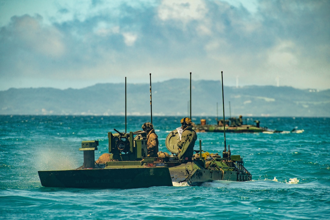 U.S. Marine Corps Amphibious Combat Vehicles attached to Alpha Company, Battalion Landing Team 1/5, 15th Marine Expeditionary Unit, conduct waterborne operations at White Beach Naval Facility, Okinawa, Japan, June 24, 2024.