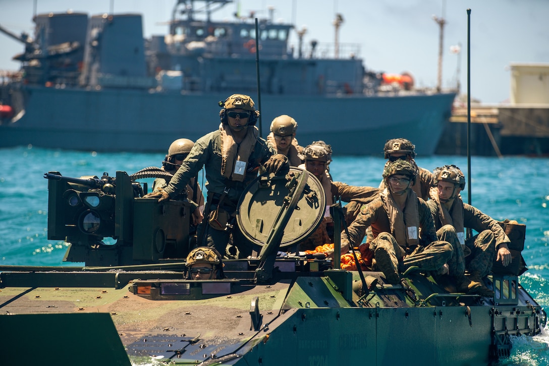 U.S. Marines assigned to Alpha Company, Battalion Landing Team 1/5, 15th Marine Expeditionary Unit, prepare to conduct a troop transfer during an Amphibious Combat Vehicle egress drill at White Beach Naval Facility, Okinawa, Japan, June 24, 2024. Harpers Ferry and embarked elements of the 15th MEU are conducting routine operations in the U.S. 7th Fleet area of operations. 7th Fleet is the U.S. Navy’s largest forward-deployed numbered fleet, and routinely interacts and operates with allies and partners in preserving a free and open Indo-Pacific region. (U.S. Marine Corps photo by Lance Cpl. Peyton Kahle)