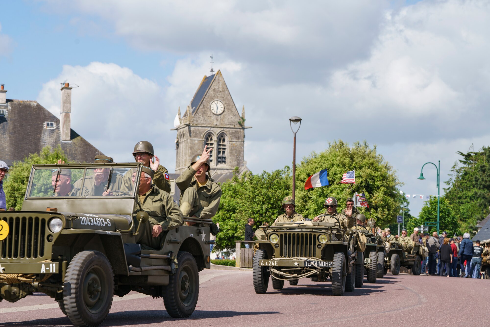 WWII reenactors put on a parade in Sainte-Mere-Eglise, Normandy, France, June 5, 2024. The U.S. Army and members from European allied nations are participating in the 80th anniversary of Operation Overlord, supporting local events across Normandy, from June 1- 10, 2024 to commemorate the selfless actions by all the allies on D-Day that continue to resonate 80 years later. (U.S. Army photo by Staff Sgt. Keith Thornburgh)