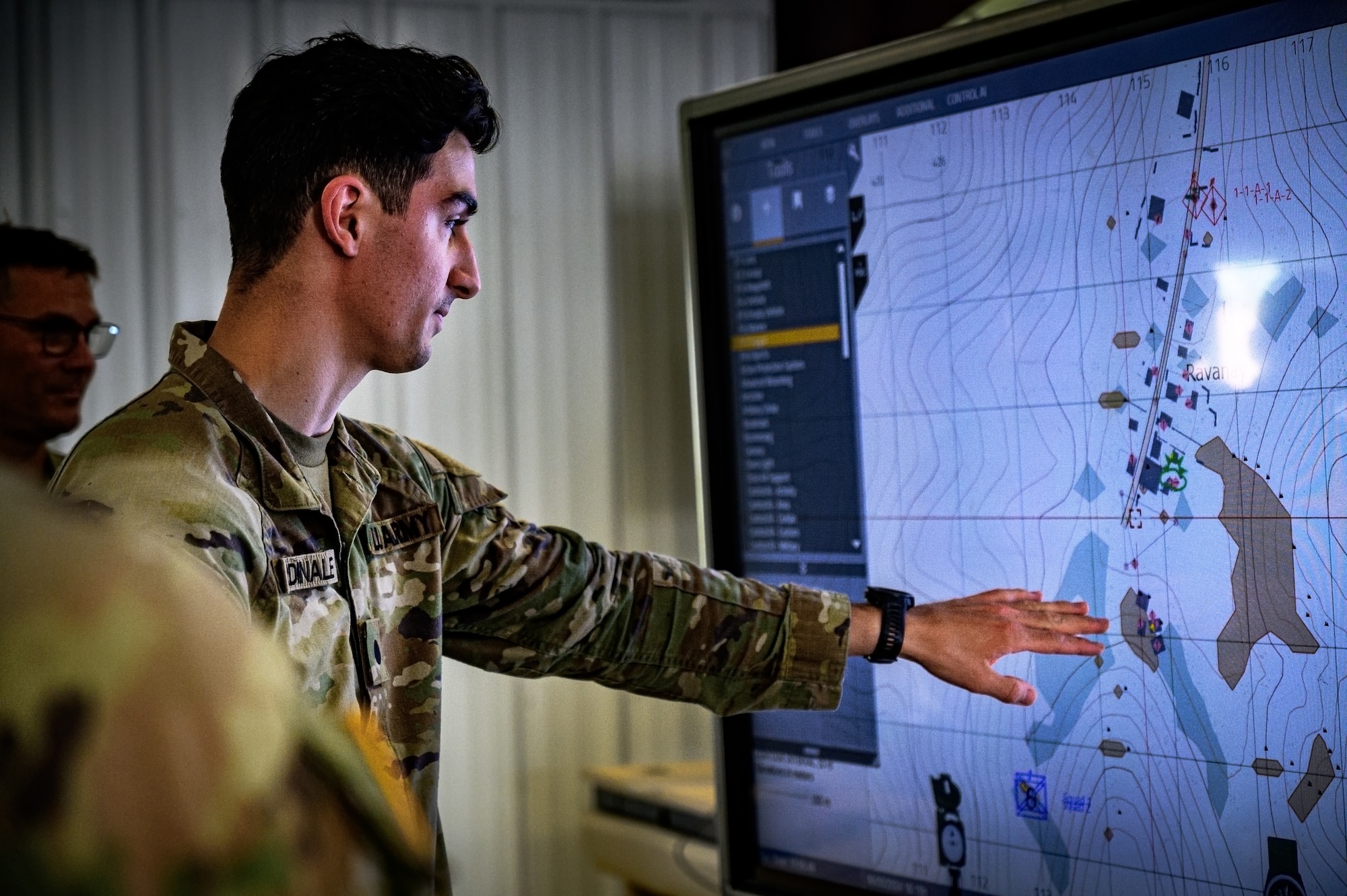 U.S. Army Reserve Soldiers assigned to the 316th Sustainment Command view a virtual layout of a battlefield at Joint Base McGuire-Dix-Lakehurst, N.J., June 3, 2024. Reservists are required to attend a two-week training exercise annually, where they engage in realistic scenarios designed to prepare them for real-world conflicts. (U.S. Air Force photo by Senior Airman Matt Porter)