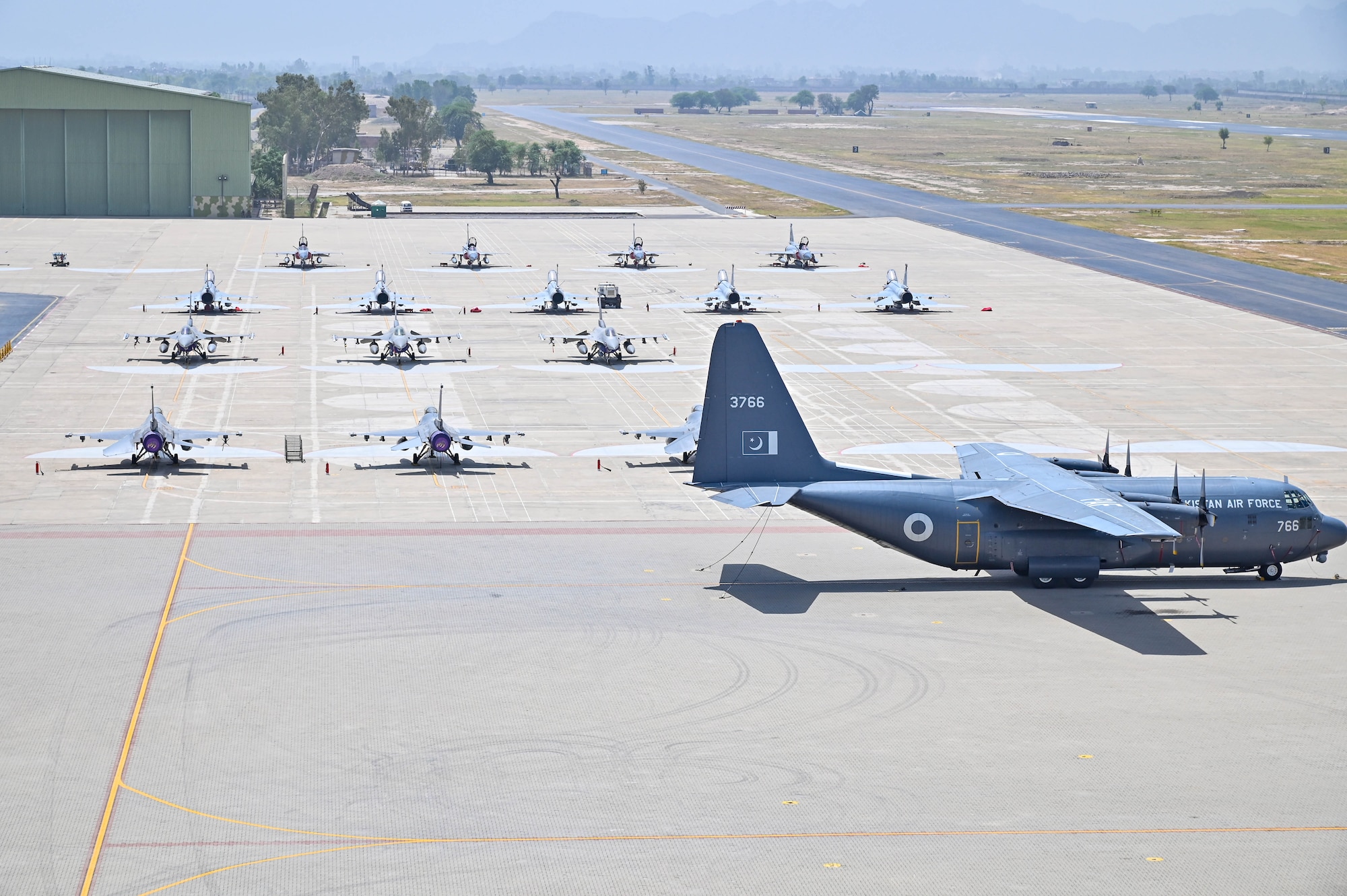 U.S. Air Force and Pakistan Air Force aircraft sit parked on a flightline in an undisclosed location in Pakistan during Exercise Falcon Talon, June 6, 2024.