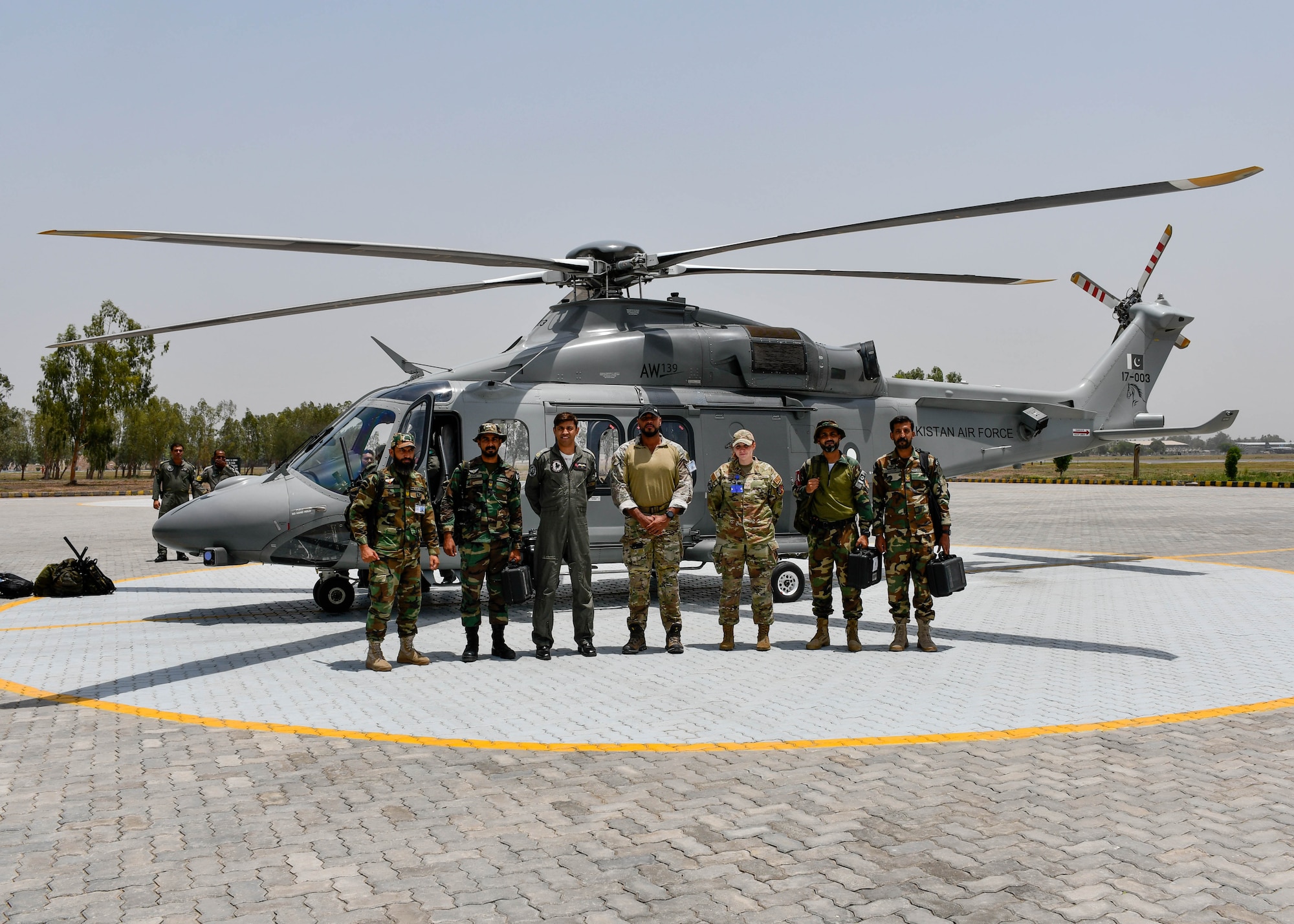 U.S. Air Force Airmen currently deployed to the U.S. Central Command area of responsibility stand with Airmen from the Pakistan Air Force Special Services Wing before a joint terminal attack control exercise in an undisclosed location in Pakistan during Exercise Falcon Talon, June 4, 2024.