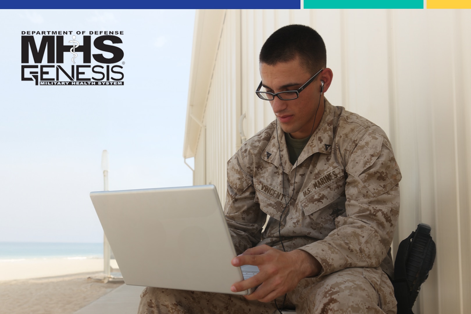 A Marine looks at his laptop