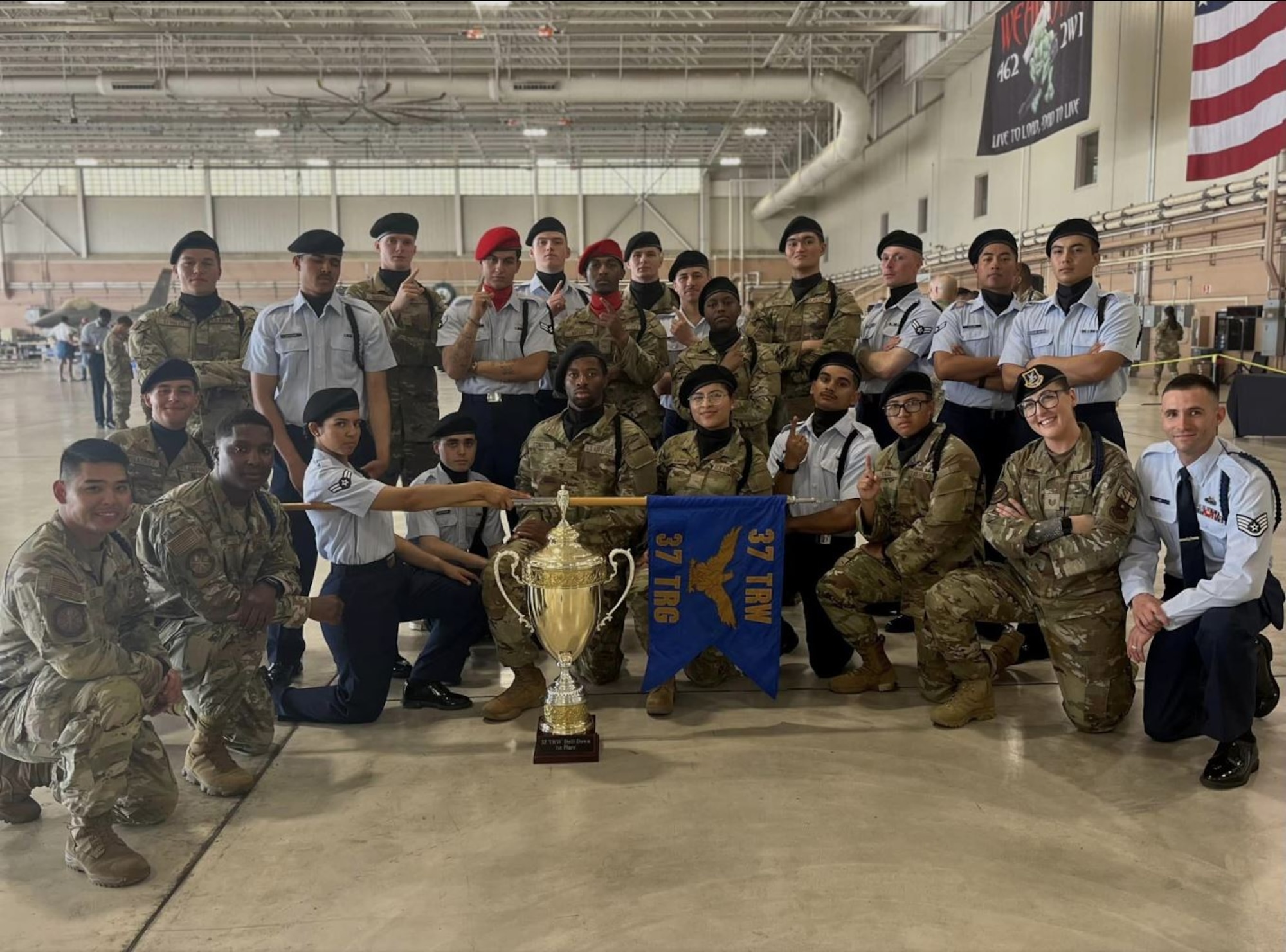 The 343rd and 344th Training Squadrons pose for a group photo next to their first-place trophy at the Second Air Force Drill Down Competition. The 343rd and 344th Training Squadrons represented the 37th Training Group and won first place in the Second Air Force Drill Down Competition at Sheppard Air Force Base, Texas, on April 27, 2024. (Courtesy Photo)