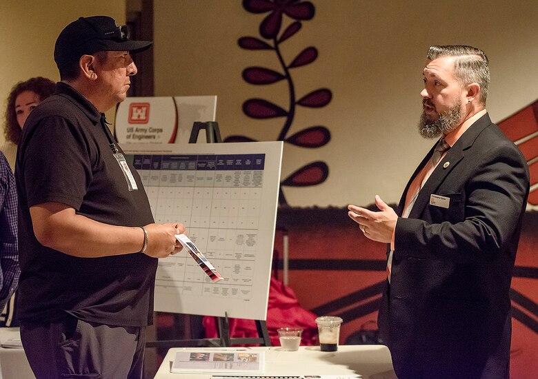 Chris Zayas (right), acequia program manager, USACE-Albuquerque District, speaks with a participant during a Tribal Nations Open House at the Indian Pueblo Cultural Center in Albuquerque, New Mexico, June 25, 2024.
