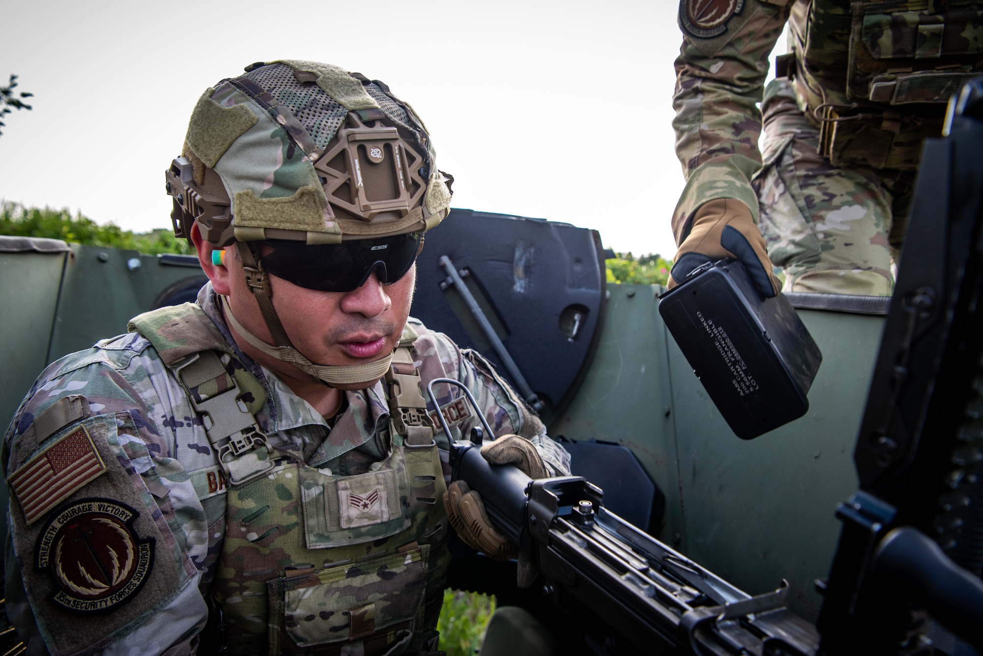 U.S. Air Force Senior Airman Miko Baluyot, 35th Security Forces Squadron alarm monitor, prepares to reload the M249 light machine gun during heavy weapons qualification at Draughon Range near Misawa Air Base, Japan, June 18, 2024.