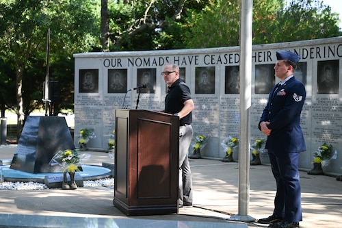 Zach Sutton, Catalyst Church of Panama City pastor and survivor of the Khobar Towers bombing, delivers a speech alongside Staff Sgt. Robby Anderson, 58th Fighter Squadron aviation resource manager and event narrator, during the 28th Annual Khobar Towers Memorial Ceremony at Eglin Air Force Base, Florida, June 25, 2024.