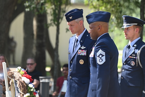 U.S. Air Force Col. David Skalicky, left, 33rd Fighter Wing commander, and U.S. Air Force Chief Master Sgt. Kelvin Hatcher, right, 33rd FW Command Chief, lay a wreath during the Khobar Towers memorial ceremony at Eglin Air Force Base, Florida, June 25, 2024.