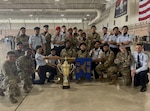 The 343rd and 344th Training Squadrons pose for a group photo next to their first-place trophy at the Second Air Force Drill Down Competition. The 343rd and 344th Training Squadrons represented the 37th Training Group and won first place in the Second Air Force Drill Down Competition at Sheppard Air Force Base, Texas, on April 27, 2024. (Courtesy Photo)