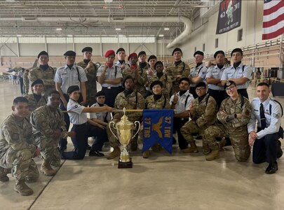 The 343rd and 344th Training Squadrons pose for a group photo next to their first-place trophy at the Second Air Force Drill Down Competition. The 343rd and 344th Training Squadrons represented the 37th Training Group and won first place in the Second Air Force Drill Down Competition at Sheppard Air Force Base, Texas, on April 27, 2024. (Courtesy Photo)