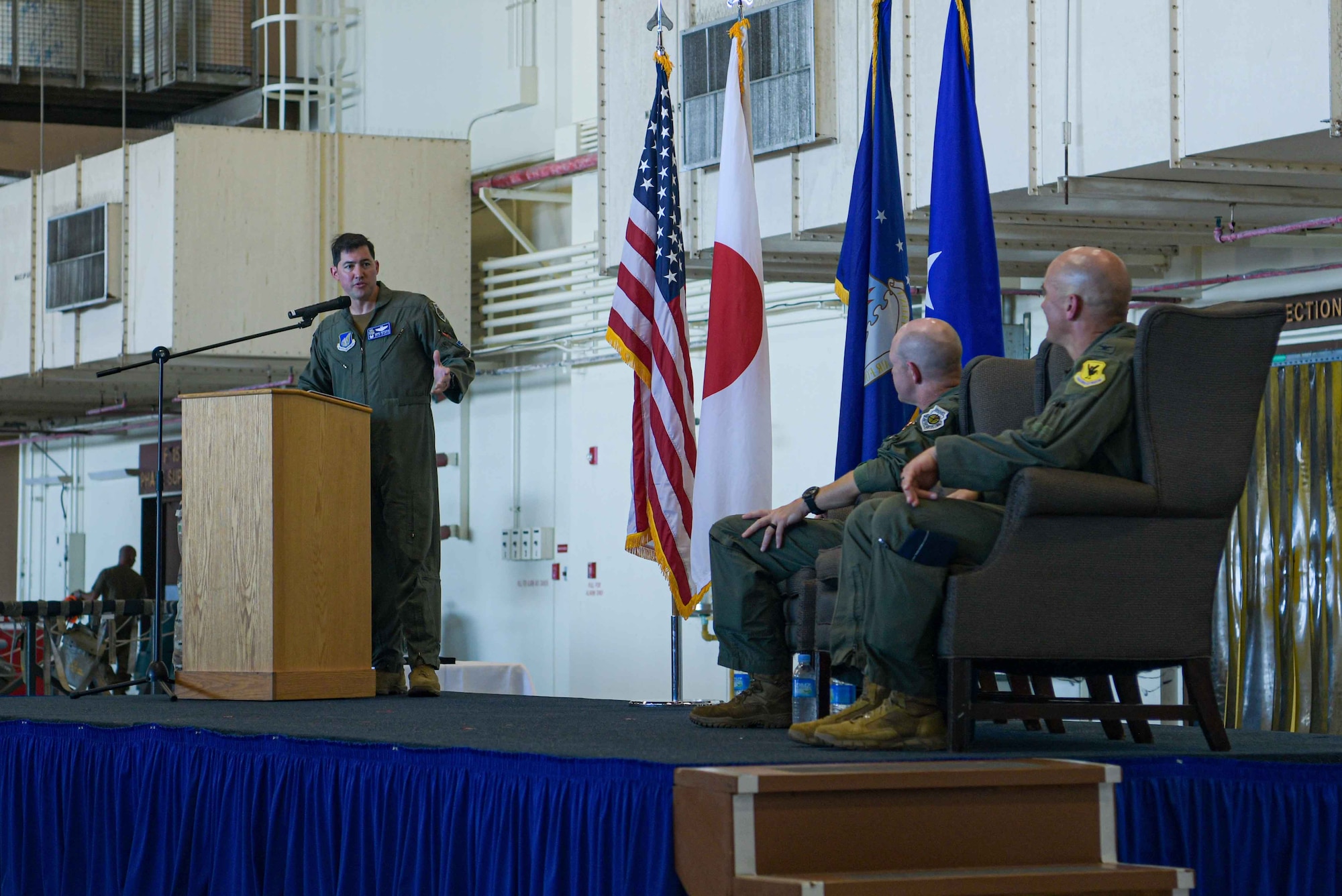 U.S. Air Force Col. David Deptula, incoming 18th Operations Group commander, acknowledges Col. Henry Schantz, right, outgoing 18th Operations Group commander, and Brig. Gen. Nicholas Evans, left, 18th Wing commander, during the 18th OG change of command ceremony at Kadena Air Base, Japan, June 25, 2024.
