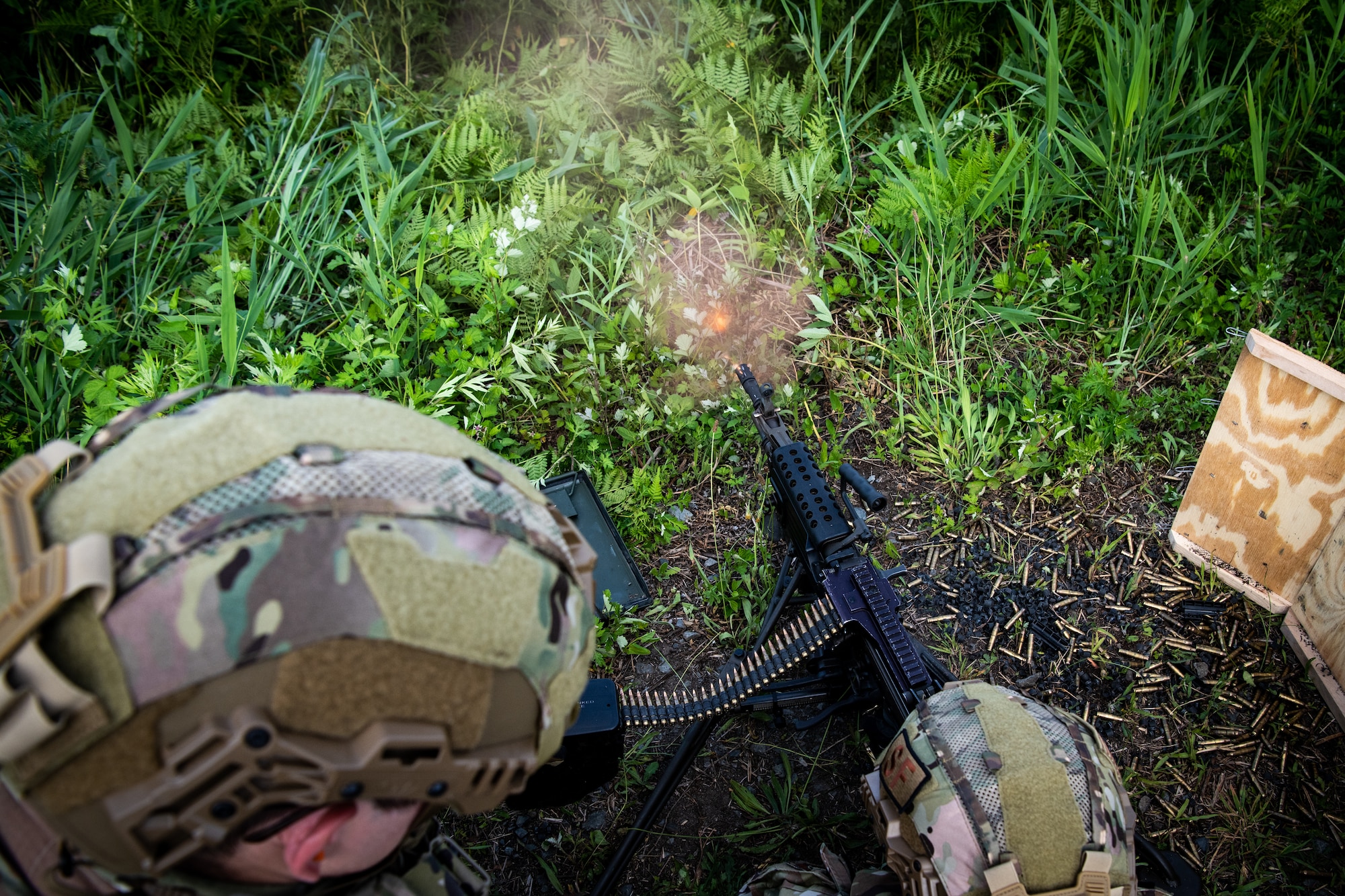 A U.S. Air Force 35th Security Forces Squadron airman fires an M249 light machine gun during heavy weapons qualification at Draughon Range near Misawa Air Base, Japan, June 18, 2024.