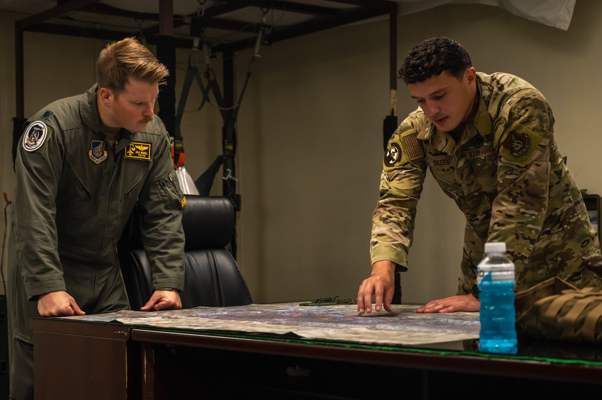Senior Airman Devan Skeem, 8th Operations Support Squadron survival, evasion, resistance, and escape specialist, teaches coordinate identification