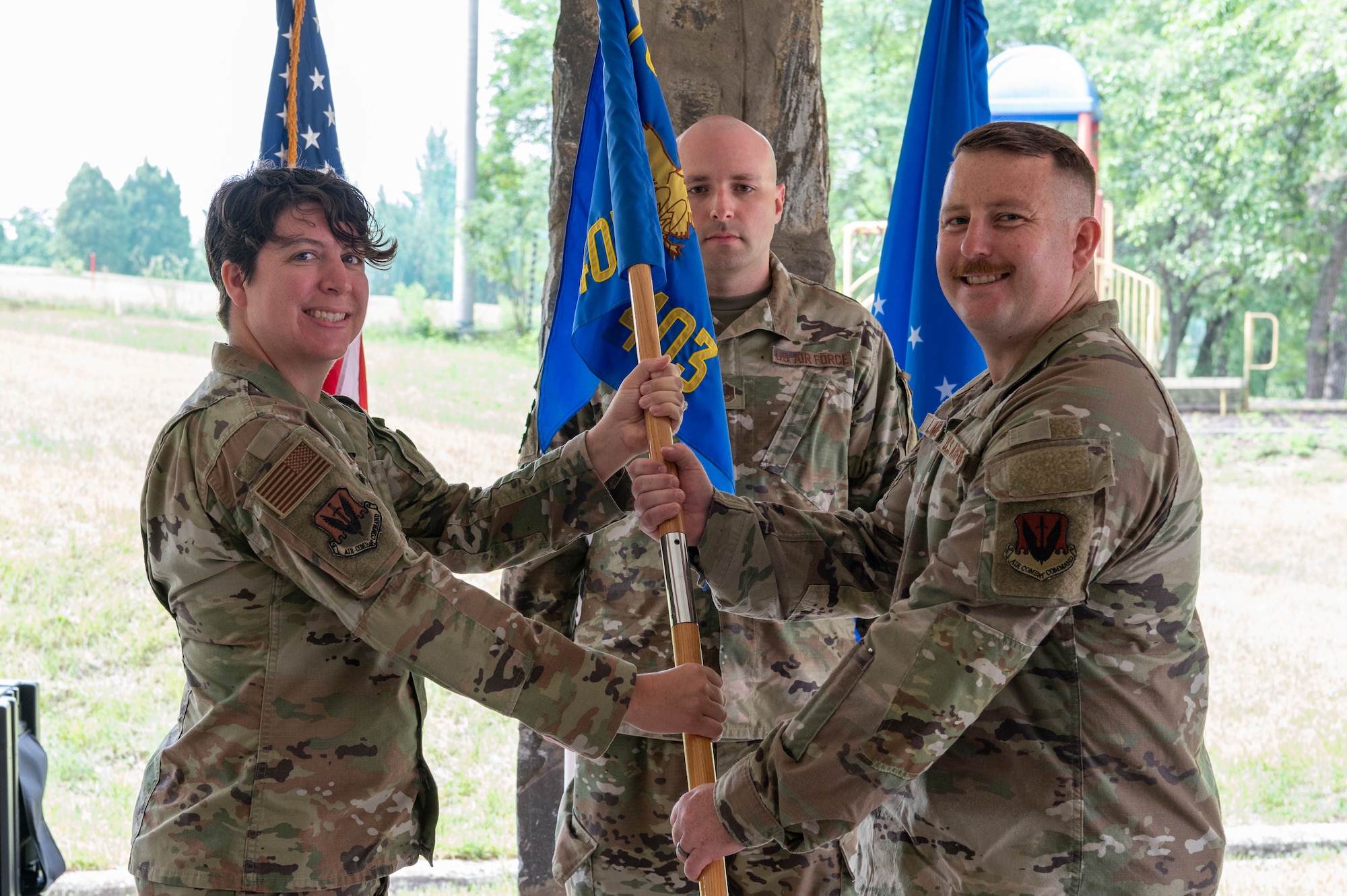 U.S. Air Force Capt. Zachary LaMere, right, accepts command of Air Force Technical Applications Center, 709th Technical Maintenance Squadron, Detachment 403 from Lt. Col. Emily Pollard, left, 709th Technical Maintenance Squadron commander, during a change of command ceremony at Osan Air Base, Republic of Korea, June 24, 2024. Prior to taking command, LaMere was the Assistant Director of Operations at the 21st Surveillance Squadron, AFTAC, out of Patrick Space Force Base, Florida. (U.S. Air Force photo by Staff Sgt. Ashley N. Mikaio)