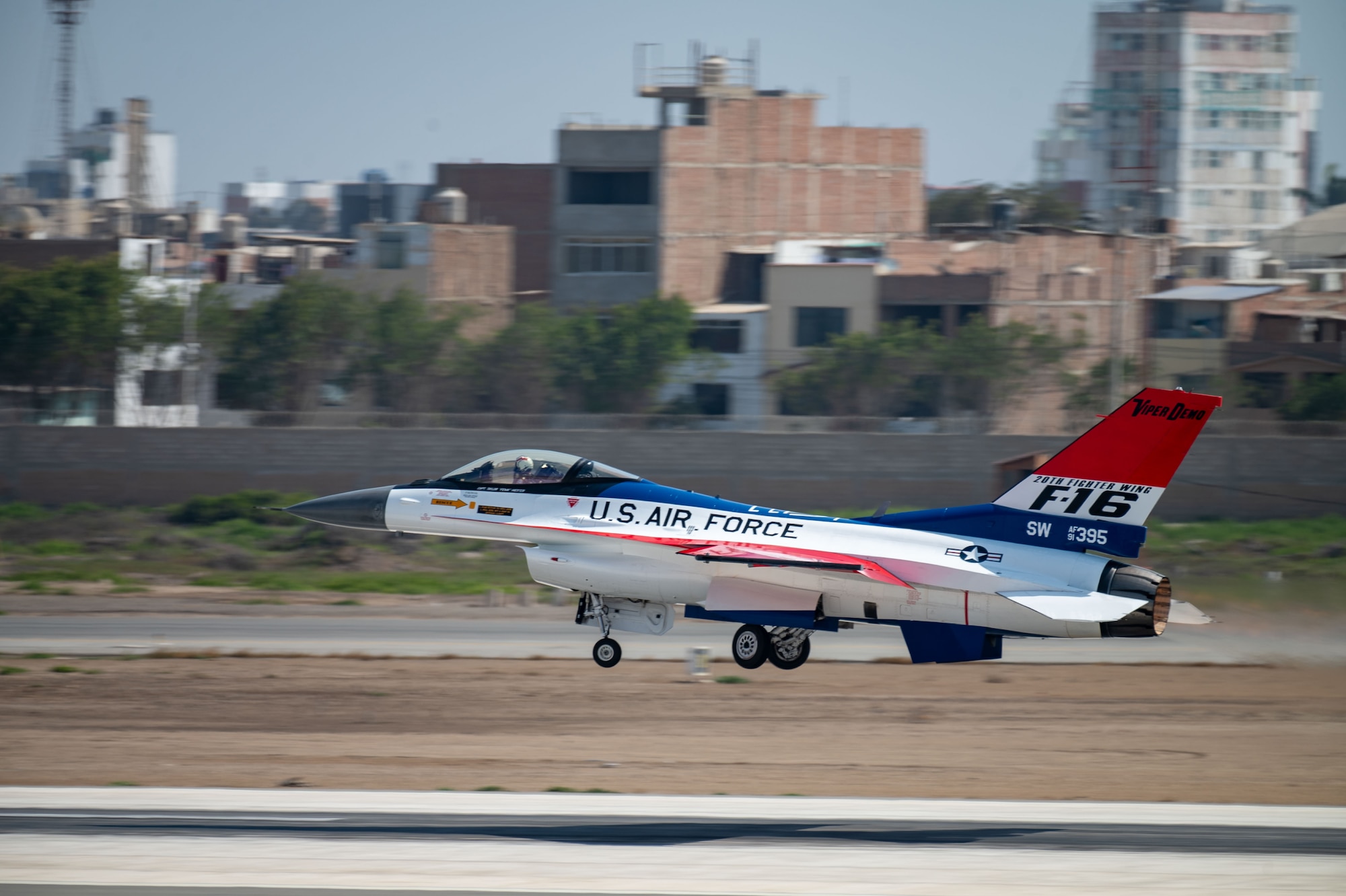 An F-16 prepares for take-off from a runway.