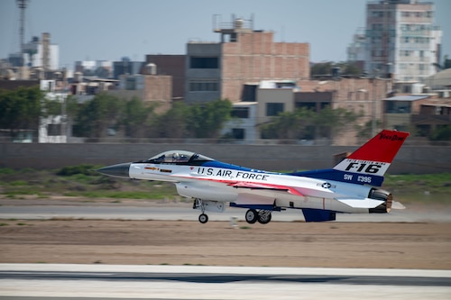 An F-16 prepares for take-off from a runway.
