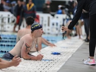 U.S. Army Pfc. Noah Strunk checks his swim time June 10, 2023, during the Department of Defense Warrior Games