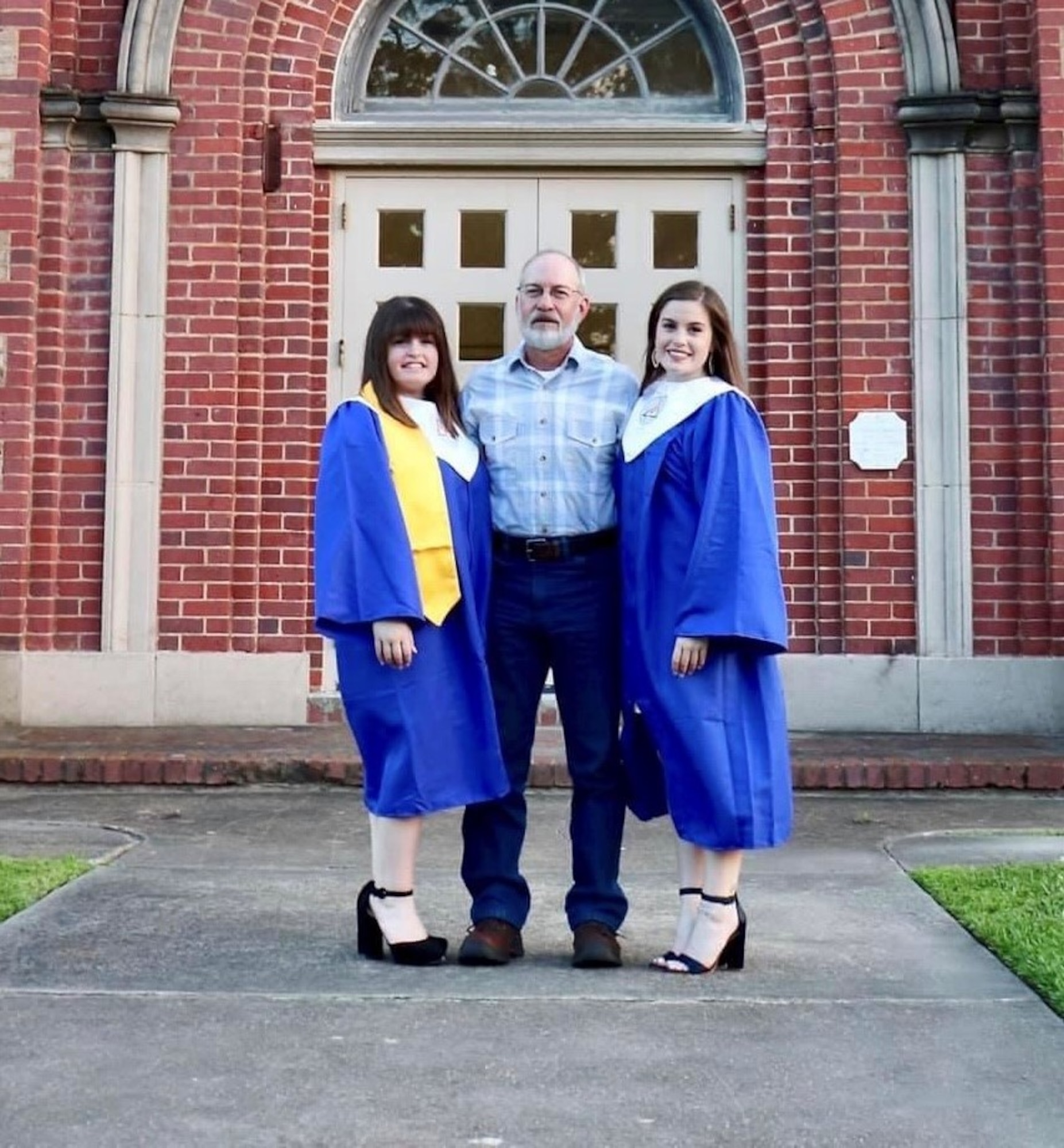From left, Hannah Guillory, Brianna Guillory's twin sister, father Jim Guillory and U.S. Space Force Spc. 4 Brianna Guillory, 4th Space Operations Squadron wideband engineer, pose for a photo with family during a high school graduation in 2019. Brianna Guillory would later enlist into the U.S. Space Force in 2020. (Courtesy photo)
