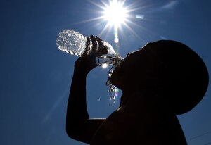 Summer weather can be unpredictable. Increasing water intake can help people avoid heat exhaustion when working or playing outdoors. (Reference Photo ID in DVIDS 2048739 Staff Sgt. Sheila deVera)