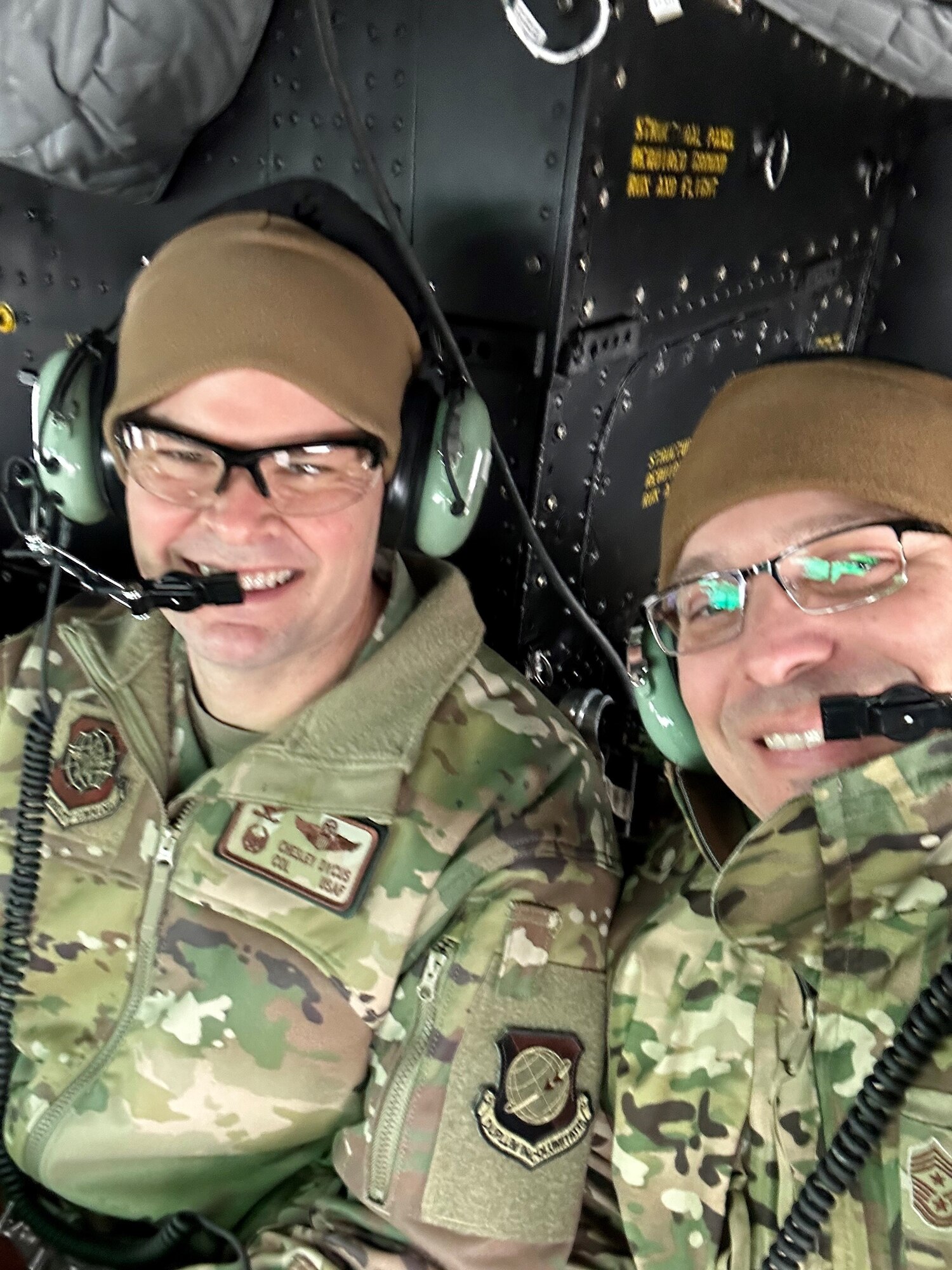Two military members take a selfie together.