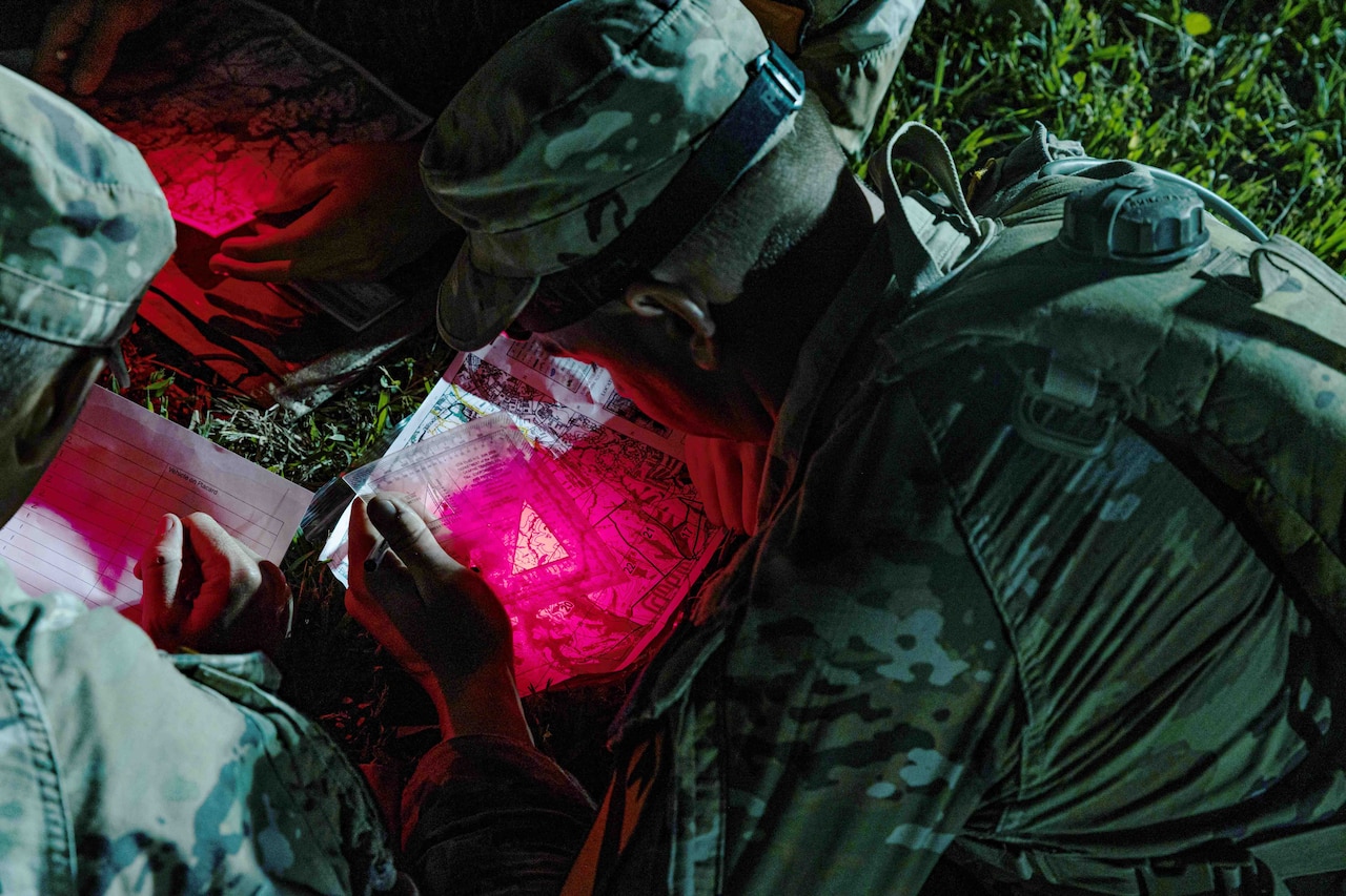 Soldiers take part in land navigation training.