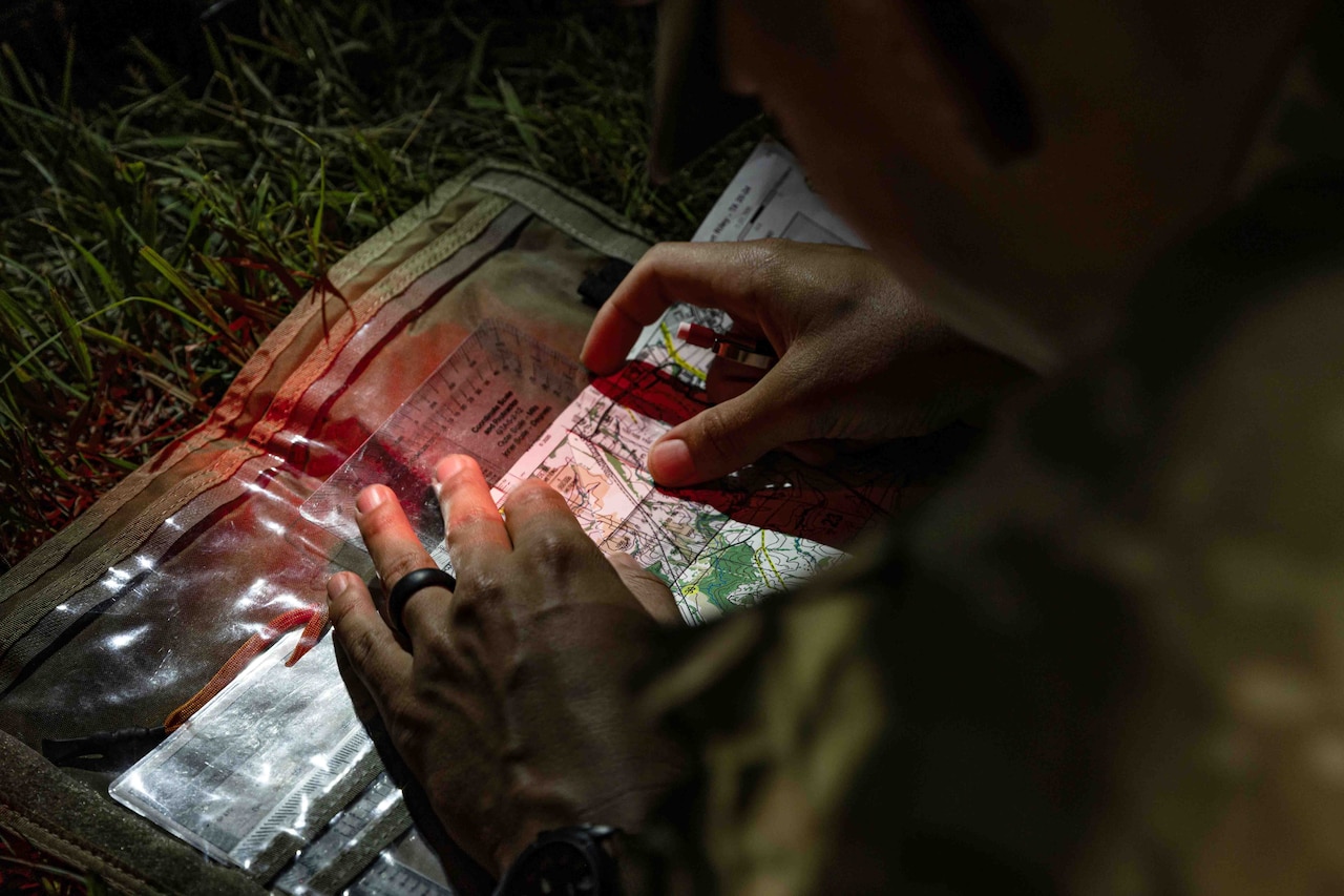 Soldiers take part in land navigation training.