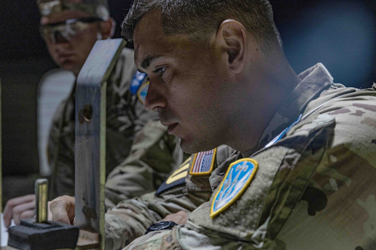 Soldiers take part in land navigation training.