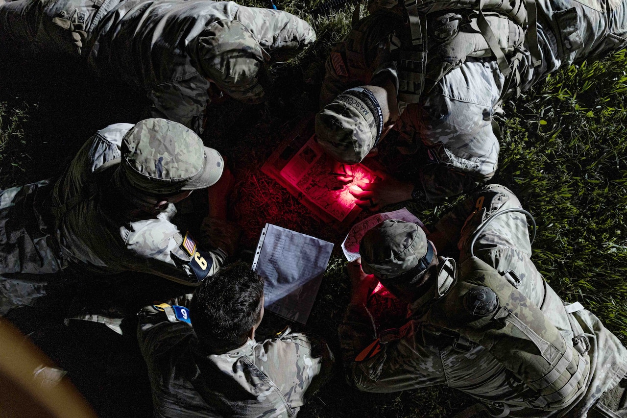 Soldiers take part in land navigation training.