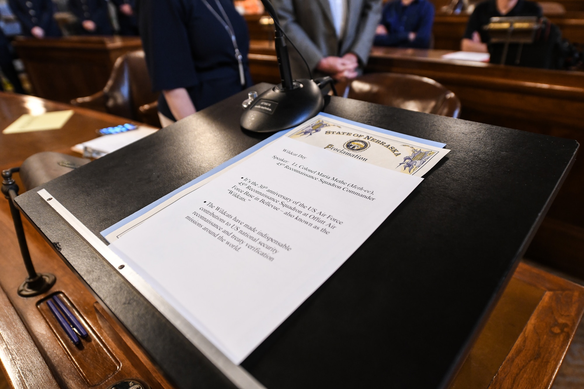 proclamation sits on podium