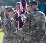 Incoming U.S. Army Medical Department Activity Fort Stewart commander and Winn Army Community Hospital director Col. Margaret Berryman accepts the unit's colors from the commander of U.S. Army Medical Readiness Command, East and Defense Health Network, East, Brig. Gen. Lance Raney during the June 26 change of command ceremony for the hospital at Fort Stewart's Cottrell Field.