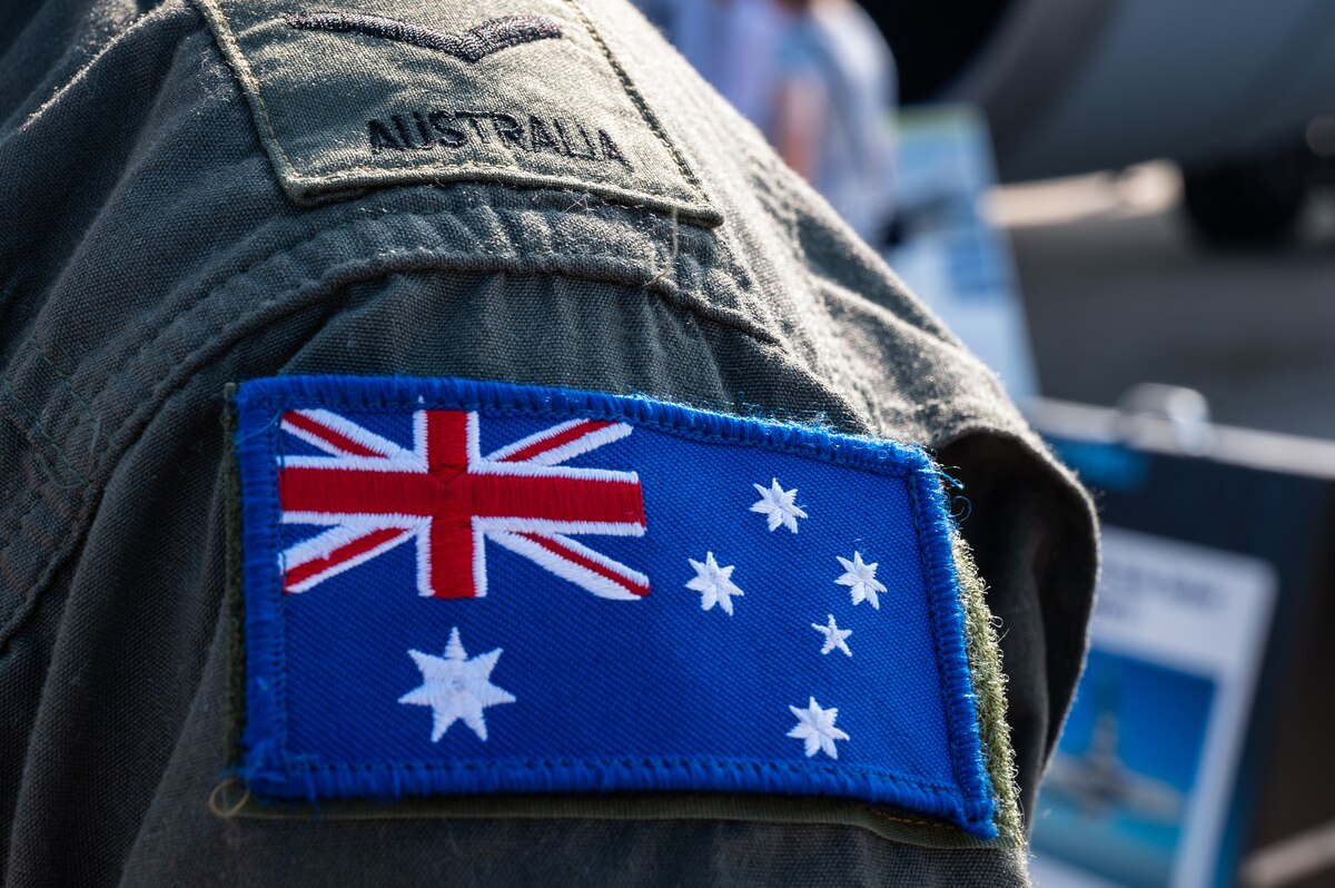 An Australian patch stands before the Royal Australian Air Force KC-30A Airbus at Pease Air National Guard Base, Newington, N.H, Sep 9, 2023. The RAAF participated in the Thunder Over New Hampshire Air Show and Open House, Sept. 9-10. (U.S. Air National Guard photo by Staff Sgt. Timothy Hayden)