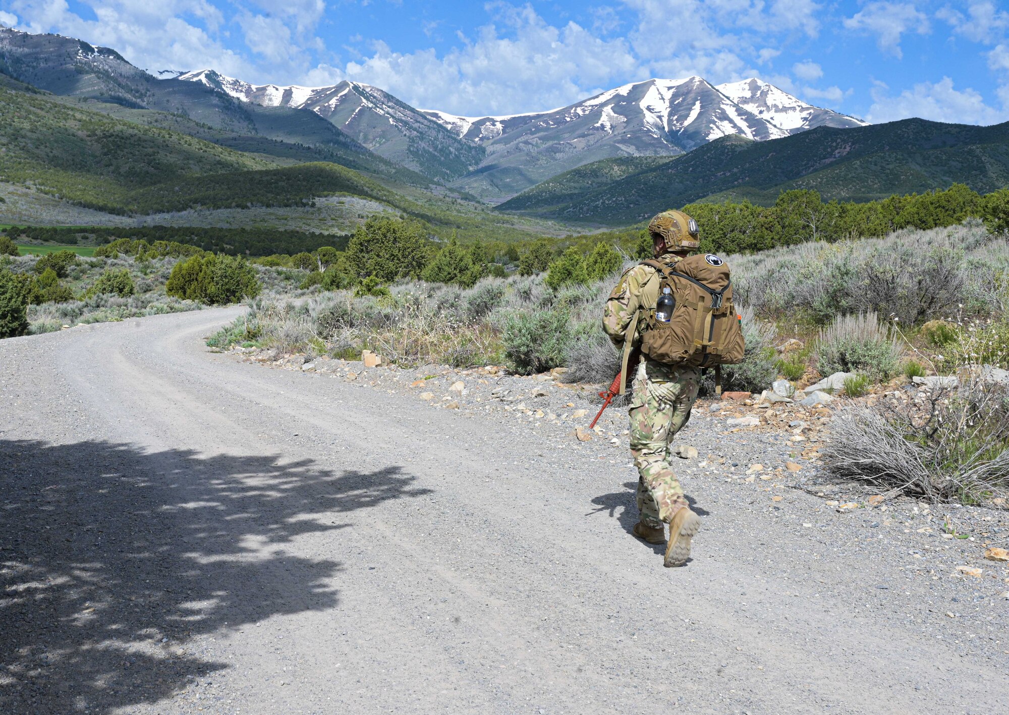 Airman rucking through a mountain.