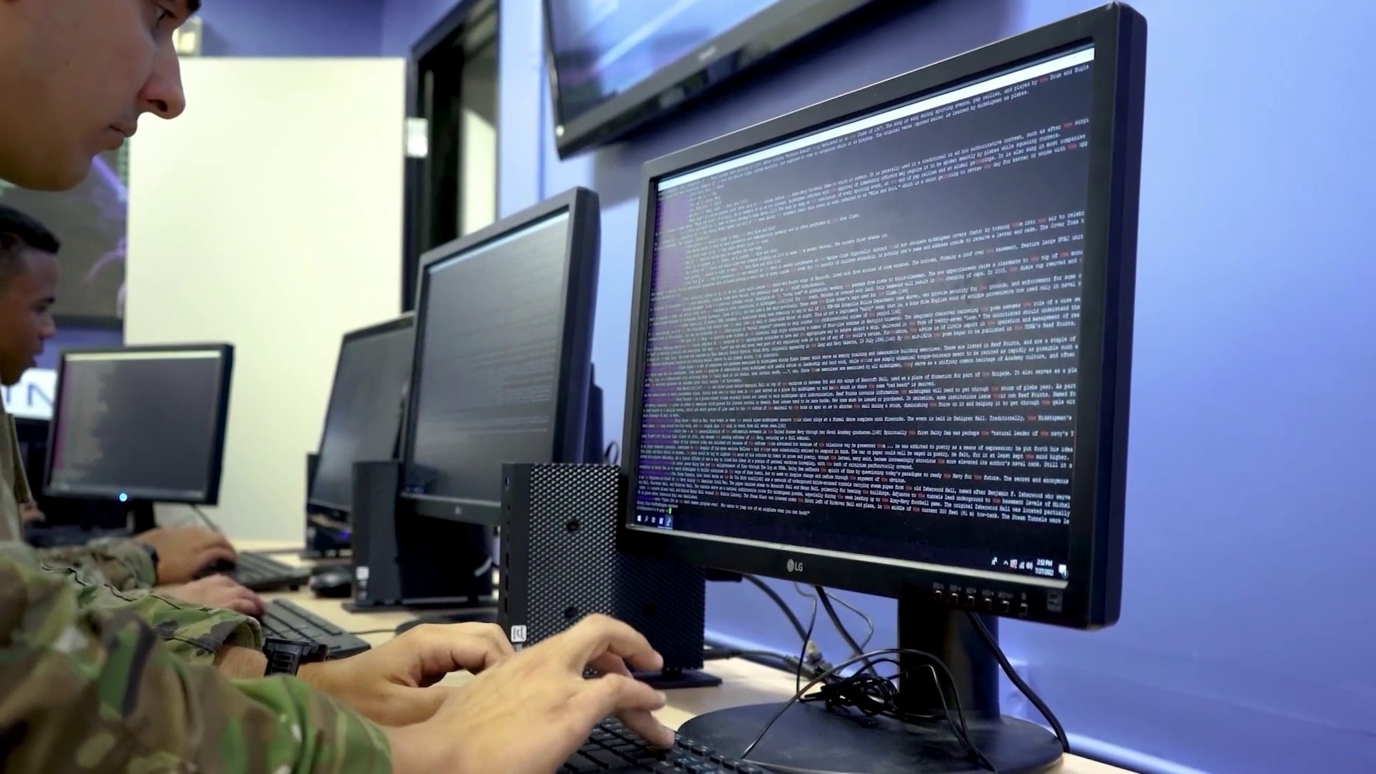 Person using a keyboard and typing code