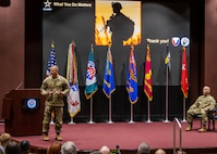 Soldier talking on stage.