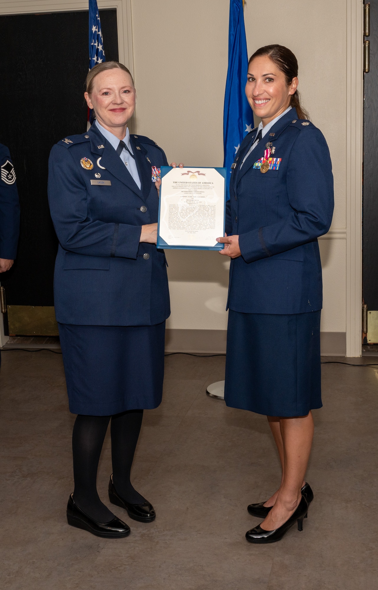 U.S. Air Force Col. Angela Lacek, 47th Medical Group commander, presents the Meritorious Service Medal to Lt. Col. Elena Arushanyan, 47th Operational Medical Readiness Squadron (OMRS) commander, during the 47th OMRS change of command ceremony at Laughlin Air Force Base, Texas, June 21, 2024. The Meritorious Service Medal was established as the counterpart of the Bronze Star Medal for the recognition of meritorious noncombatant service. (U.S. Air Force photo by Staff Sgt. Nicholas Larsen)