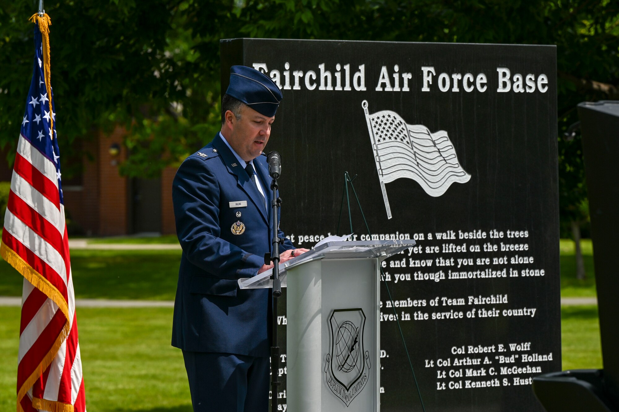 A U.S. Air Force officer speaks at a podium.