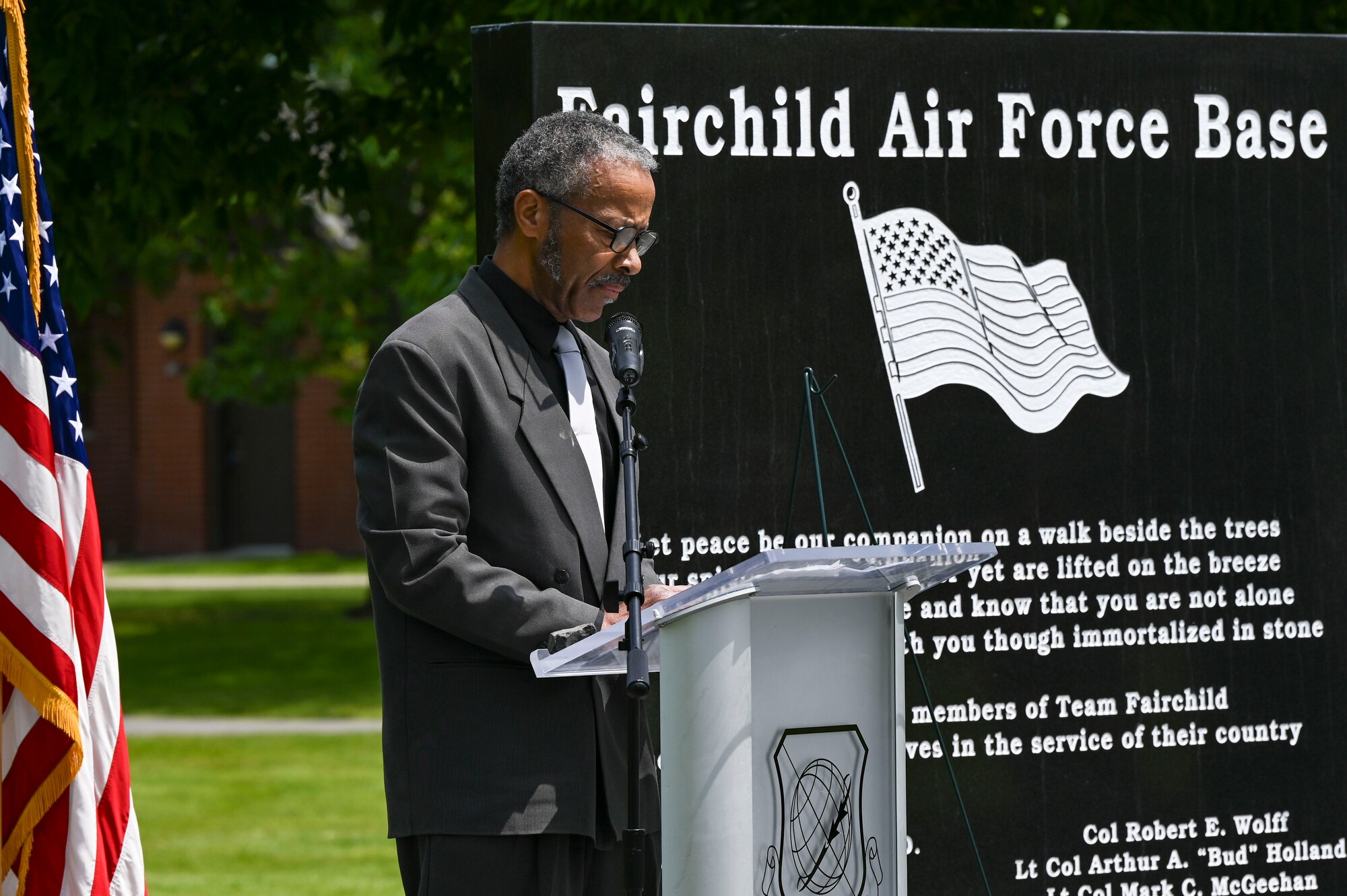 A man speaks at a podium