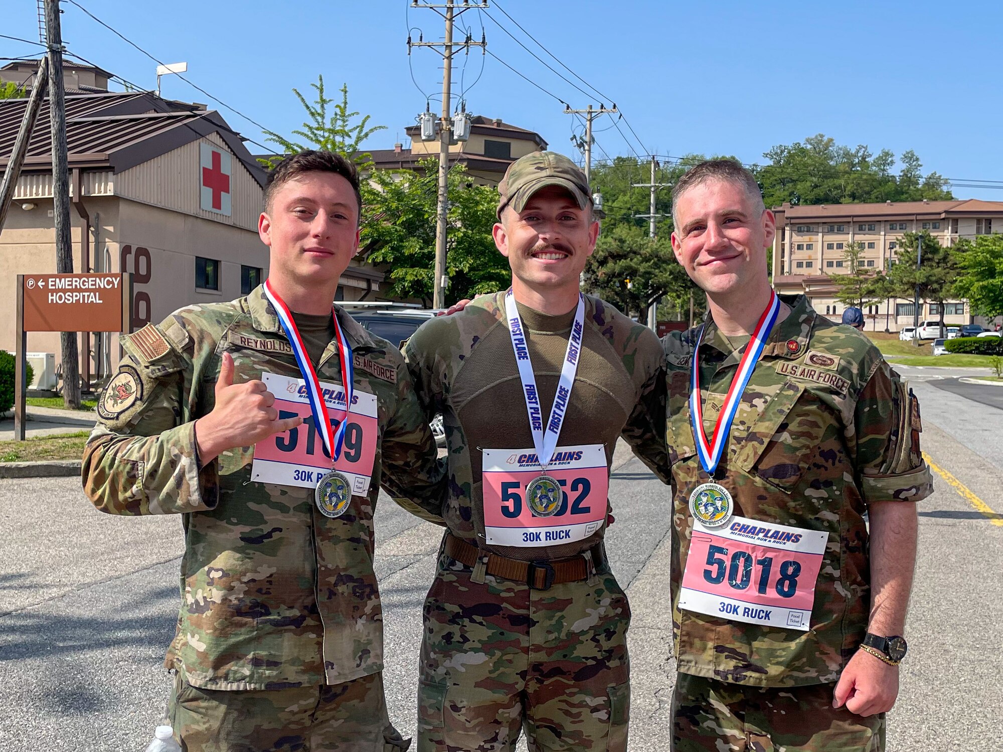 U.S. Air Force Airmen pose for a photo after placing in the top three during the Norwegian Foot March Foreign Military Badge ceremony at Osan Air Base, Republic of Korea, June 21, 2024. Participants were required to wear their uniforms, and weigh their rucksacks before and after the march to ensure correct weight and measurement. (Courtesy photo)