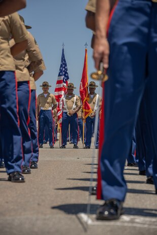 U.S. Marines with Recruit Training Regiment, Marine Corps Recruit Depot San Diego color guard, stand at parade rest during the Support Battalion change of command ceremony for Lt. Col. Arthur L. Graham III at Marine Corps Recruit Depot San Diego, California, June 14, 2024. Graham III relinquished command to Lt. Col. John B. Dickens, who took charge of Support Battalion at MCRD San Diego. (U.S. Marine Corps photo by Lance Cpl. Janell B. Alvarez)