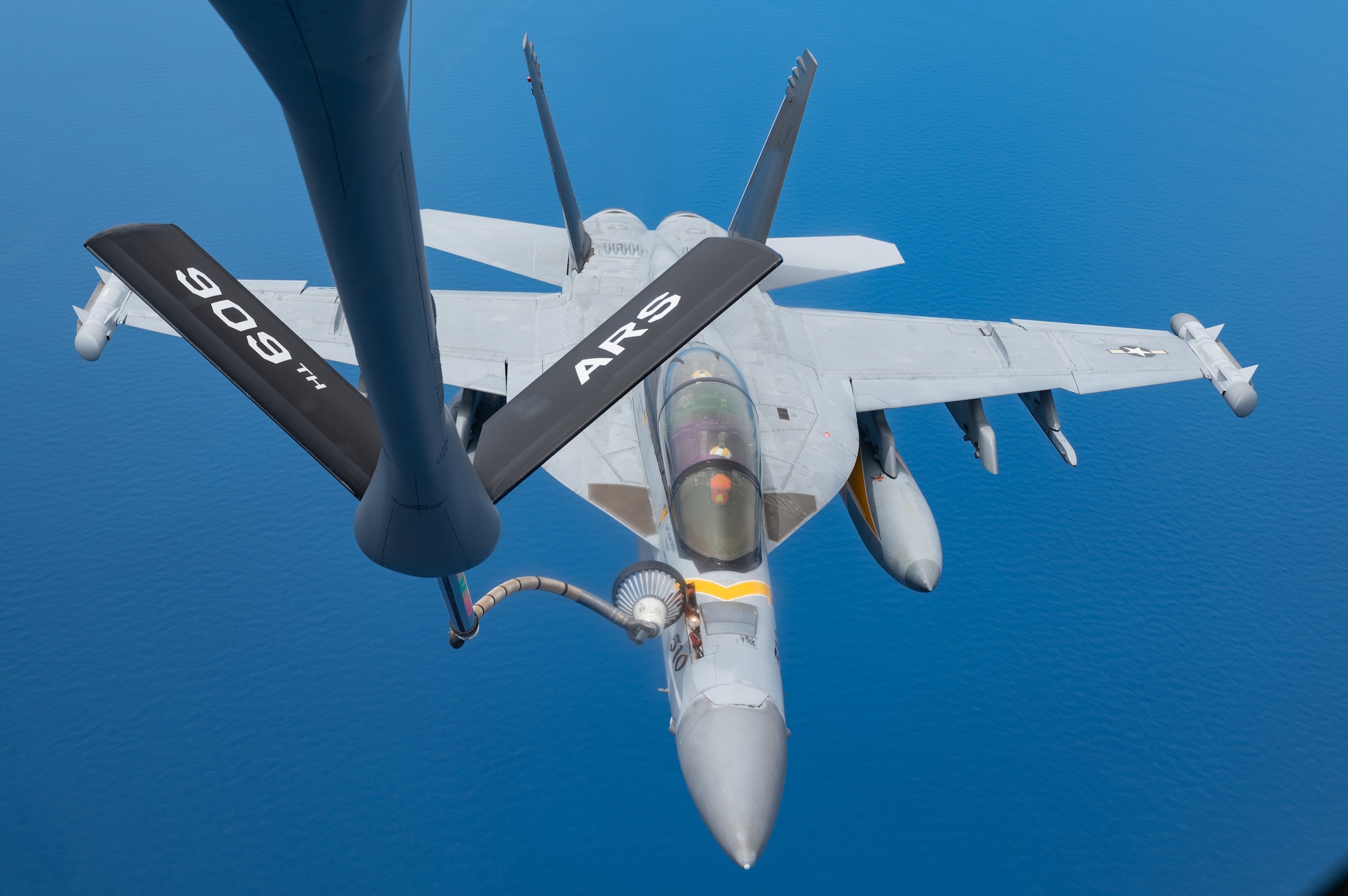 An EA-18 conducts aerial refueling.