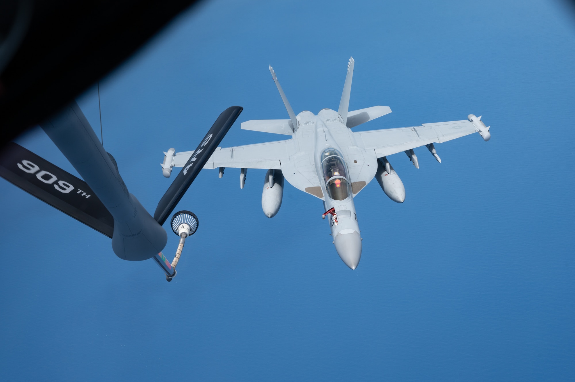 An EA-18 conducts aerial refueling.