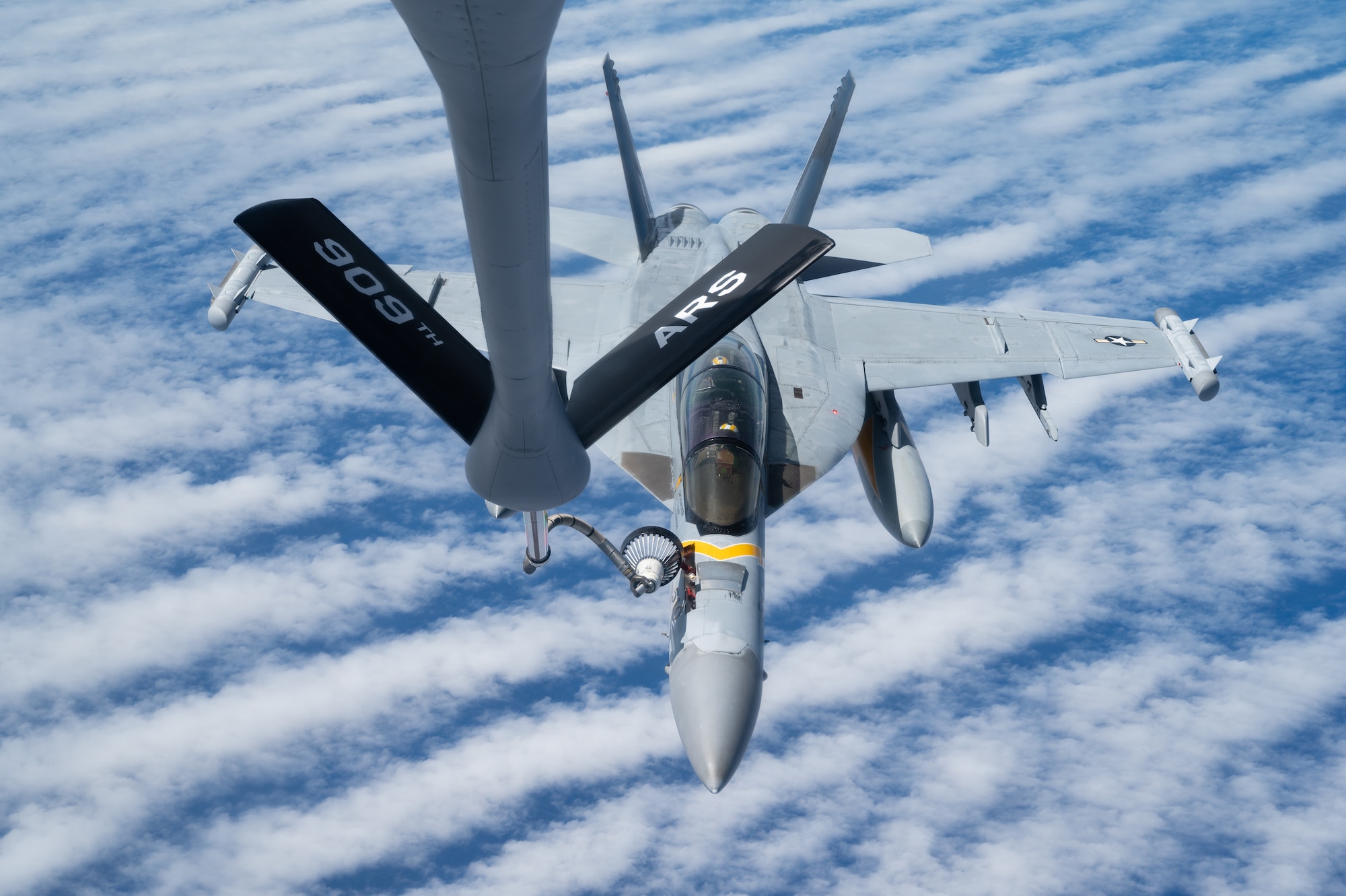 An EA-18 conducts aerial refueling.