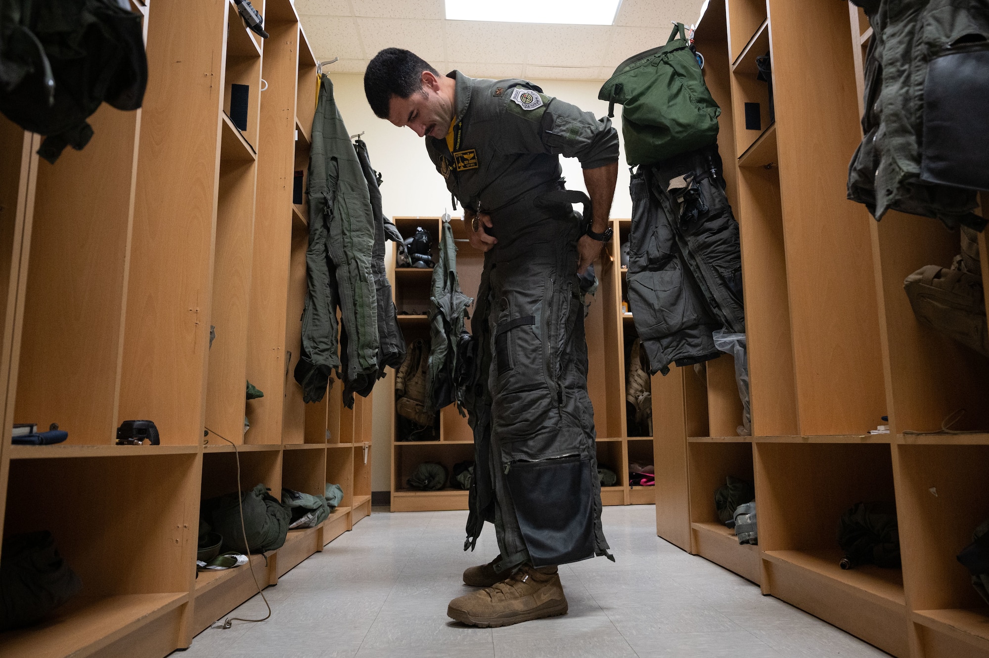 U.S. Air Force Maj. Rex Anderson, 80th Fighter Squadron pilot, puts on an anti-gravity suit.