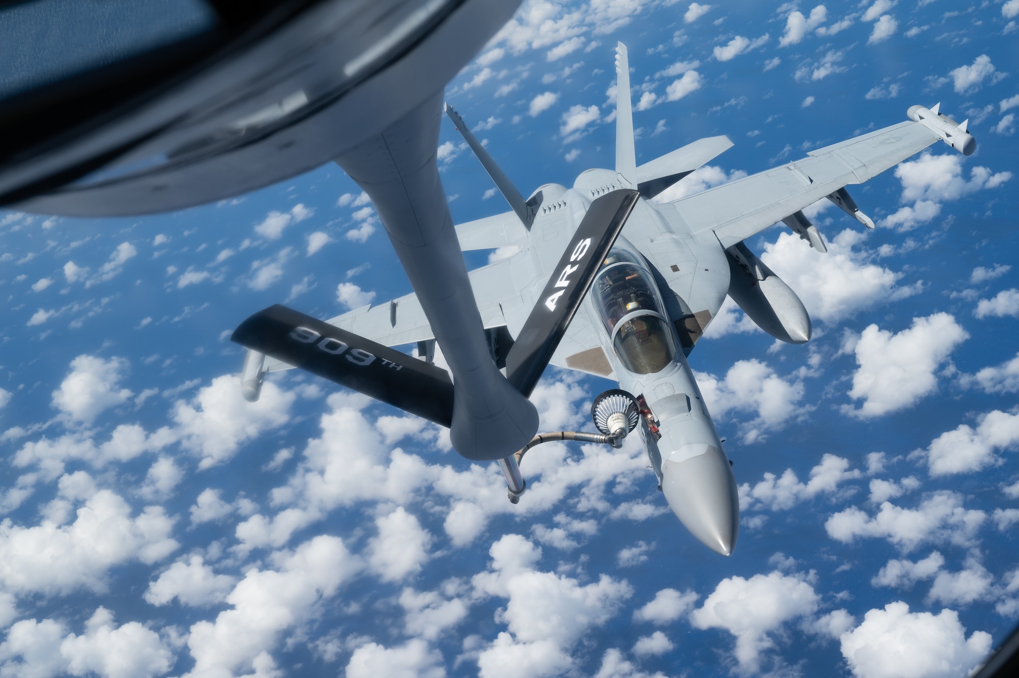 An EA-18 conducts aerial refueling.