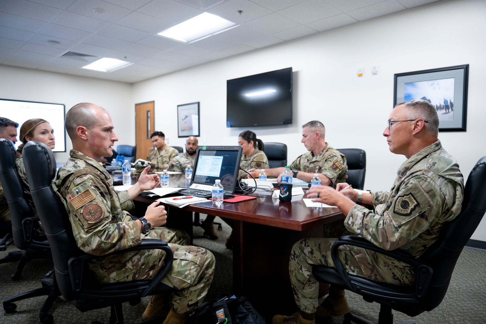 A group of people sitting at a conference table