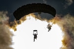 An Alaska Air National Guard combat rescue officer (CRO) assigned to the 212th Rescue Squadron descends over Malemute Drop Zone during a capabilities exercise at Joint Base Elmendorf-Richardson, Alaska, June 25, 2024. CROs, pararescuemen, and search, evasion, resistance, and escape specialists of the 212th RQS — known collectively as Guardian Angels — are experts in personnel recovery operations and are trained to infiltrate behind enemy lines to extract isolated U.S. and allied personnel.