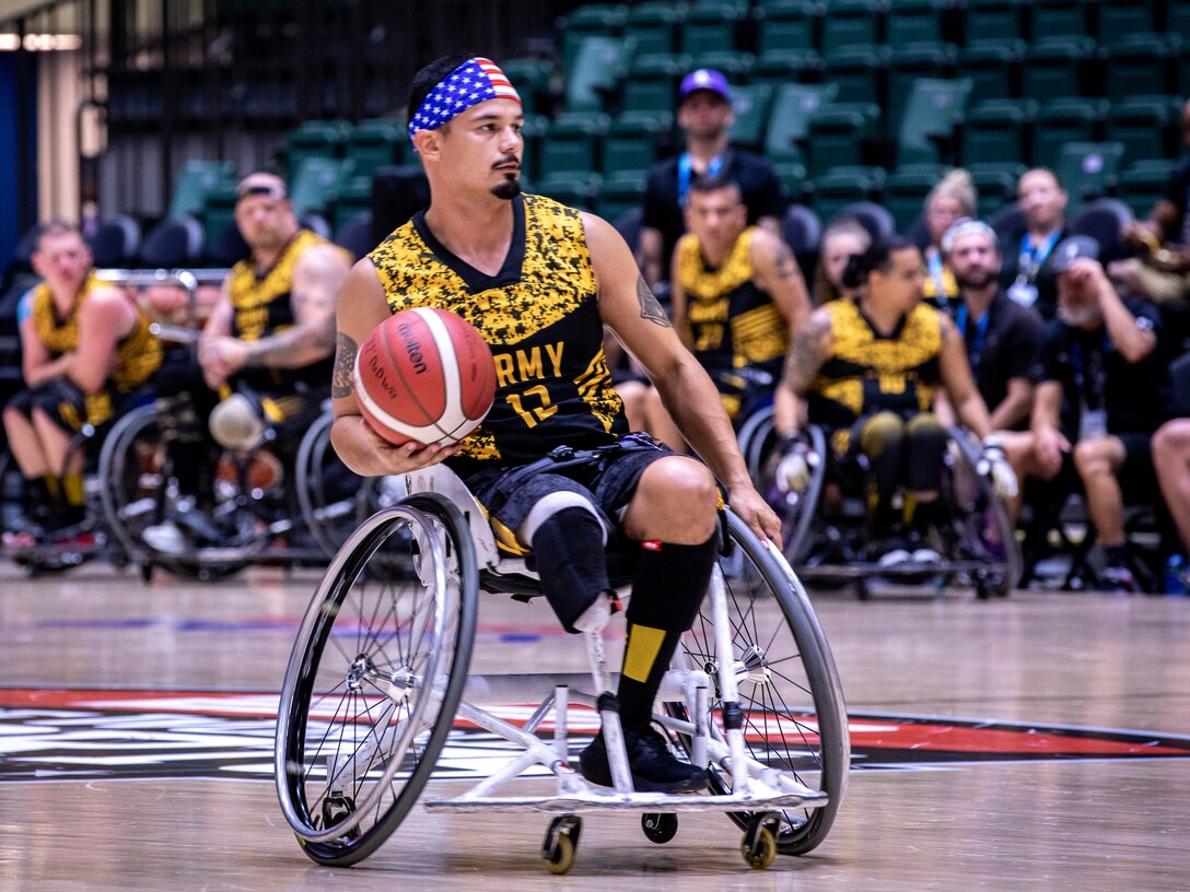 Retired U.S. Army Spc. Michael Villagran competes against Team Air Force in the gold medal wheelchair basketball game during the 2022 Department of Defense Warrior Games
