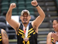 U.S. Army veteran Michael Villagran accepts Team Army's bronze medal for wheelchair rugby during the 2024 Department of Defense Warrior Games